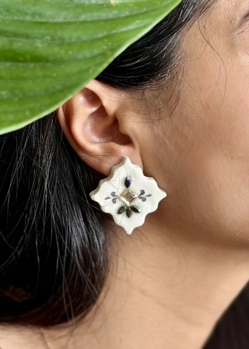Close-up of a hand-painted papier-mache earring