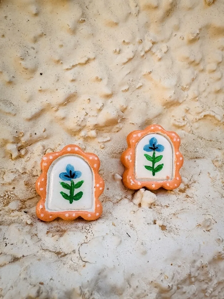 Framed flower earrings, orange edge