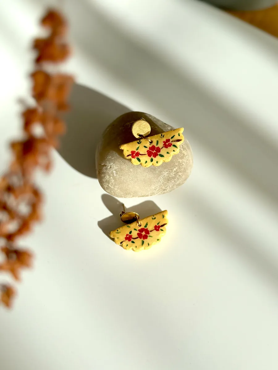 Yellow fan-shaped floral earrings